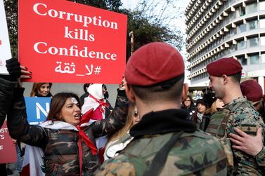 Lebanese demonstrators take part in a protest seeking to prevent MPs and government officials from reaching the parliament for a vote of confidence, in Beirut on February 11. AP