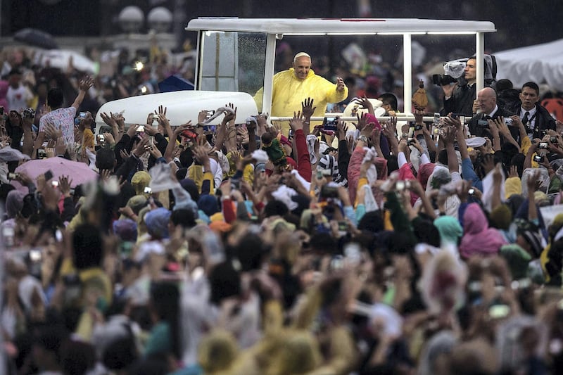 MANILA, PHILIPPINES - JANUARY 18:  Pope Francis waves to the crowd after conducting mass at the Rizal Park on January 18, 2015 in Manila, Philippines. Pope Francis will visit venues across Leyte and Manila during his visit to the Philippines from January 15 - 19. The visit is expected to attract crowds in the millions as Filipino Catholics flock to catch a glimpse of the leader of the Catholic Church in the Philippines for the first time since 1995. The Pope will begin the tour in Manila, then travelling to Tacloban to visit areas devastated by Typhoon Haiyan before returning to Manila to hold a mass at Rizal Park. The Philippines is the only Catholic majority nation in Asia with around 90 percent of the population professing the faith.  (Photo by Lam Yik Fei/Getty Images)