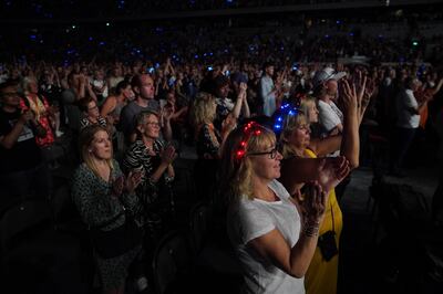 Elton John fans at his Farewell Yellow Brick Road show at the Tele2 Arena in Stockholm. PA 