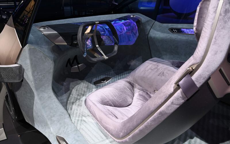 The interior of the BMW i Vision Circular concept car has seats that are designed to resemble lounge chairs. AFP