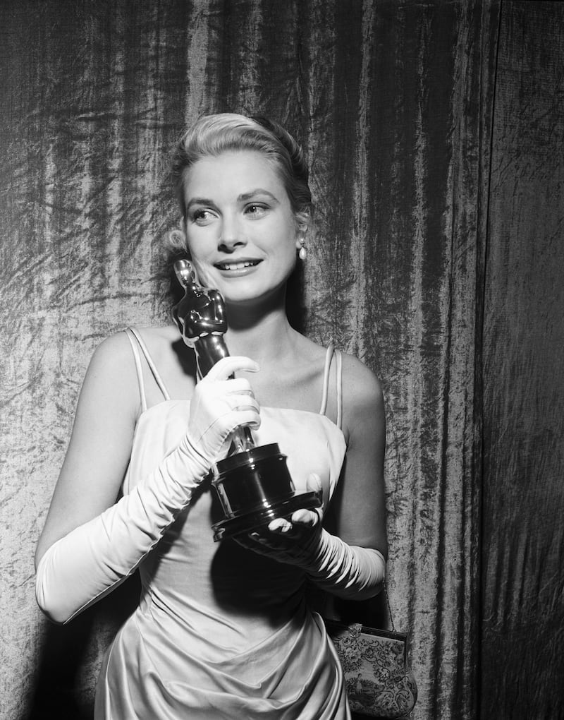 Grace Kelly clutches her Oscar at the 1954 awards after winning Best Actress for The Country Girl