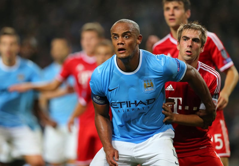Vincent Kompany of Manchester City and Philipp Lahm of Bayern Munich (Photo by AMA/Corbis via Getty Images)