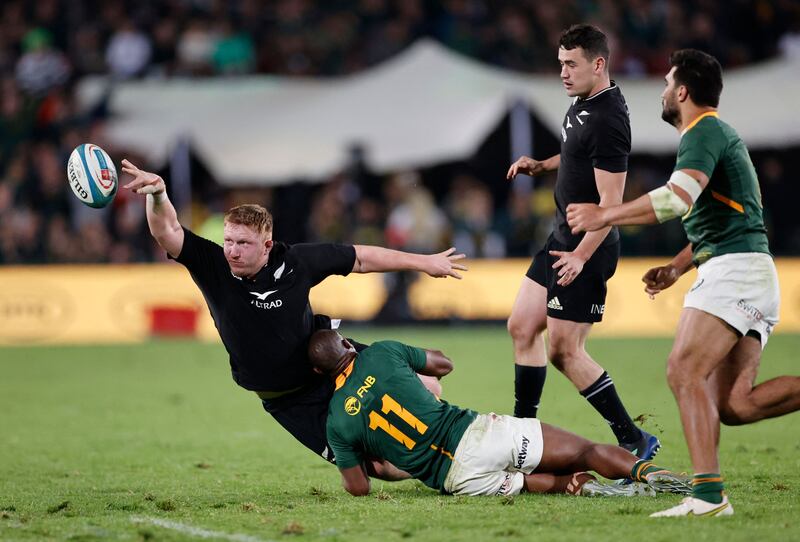 New Zealand's Fletcher Newell is tackled by South Africa's Makazole Mapimpi. AFP