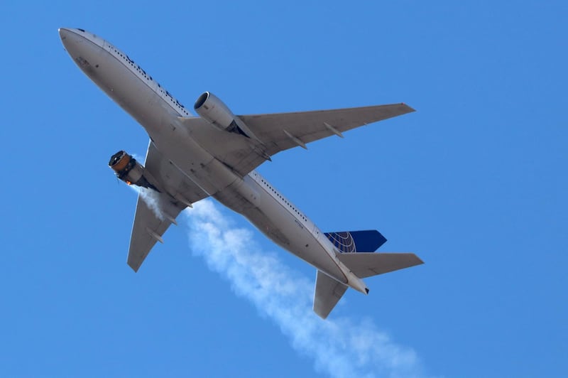 United Airlines flight UA328, carrying 231 passengers and 10 crew on board, returns to Denver International Airport with one of its engines on fire. Reuters