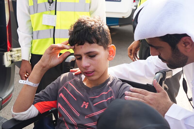 Twelve-year-old Amr Jandieh, who was wounded in the Israel-Gaza war, arrives in Abu Dhabi on Saturday. AP