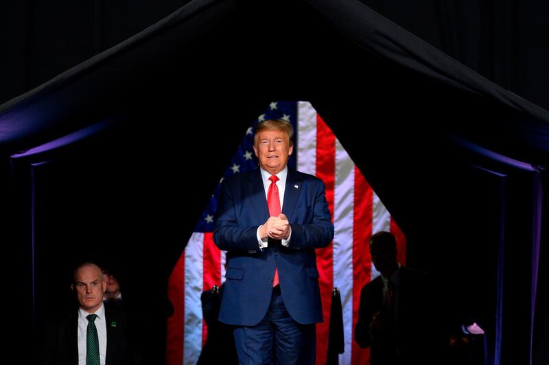 (FILES) In this file photo taken on February 19, 2020 US President Donald Trump arrives to deliver remarks at a Keep America Great rally in Phoenix, Arizona. President Donald Trump tweeted on the late hours of June 12 that he decided to postpone his rally in Tulsa, Oklahoma, originally scheduled for June 19th, the Juneteenth Holiday marking the end of slavery in America, to June 20 out of respect for this Holiday. / AFP / JIM WATSON
