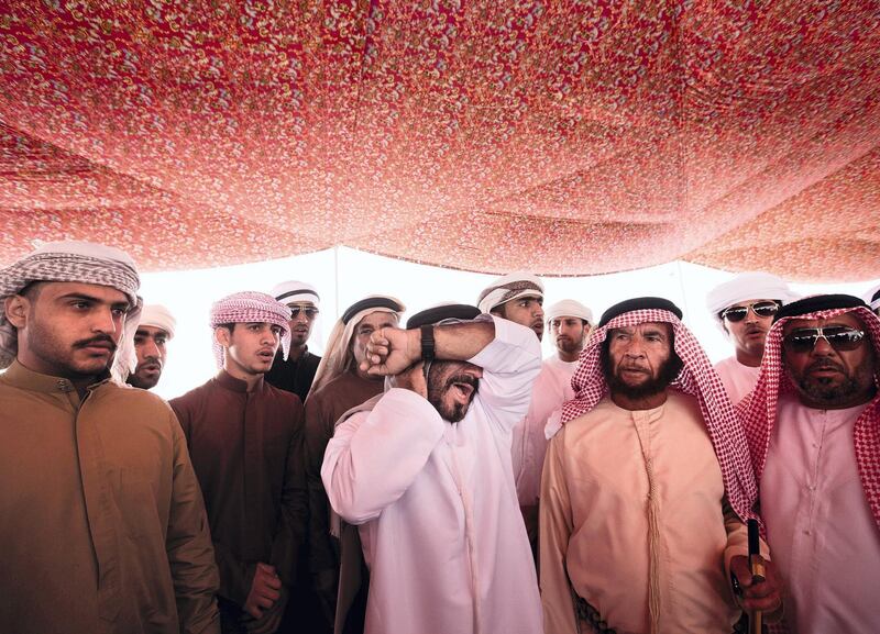 Ras Al Khaimah, United Arab Emirates, Feb 09, 2013 -  Habus men perform the Nadbah, a traditional war cry now reserved for cemonies,  during a welcoming ceremony for Ruth Ash by members of hanus and shehhuh mountain tribes at wadi qada'a. Doctora Mariam ran the first hospital in RAK and did community outreach programs from 1966-77, under protection of tribal rulers. ( Jaime Puebla / The National Newspaper ) focal point