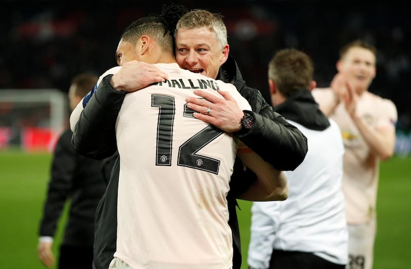 Manchester United interim manager Ole Gunnar Solskjaer and Manchester United's Chris Smalling celebrate. Reuters