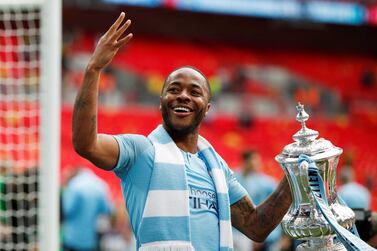 Soccer Football - FA Cup Final - Manchester City v Watford - Wembley Stadium, London, Britain - May 18, 2019 Manchester City's Raheem Sterling celebrates with the trophy after winning the FA Cup Action Images via Reuters/John Sibley