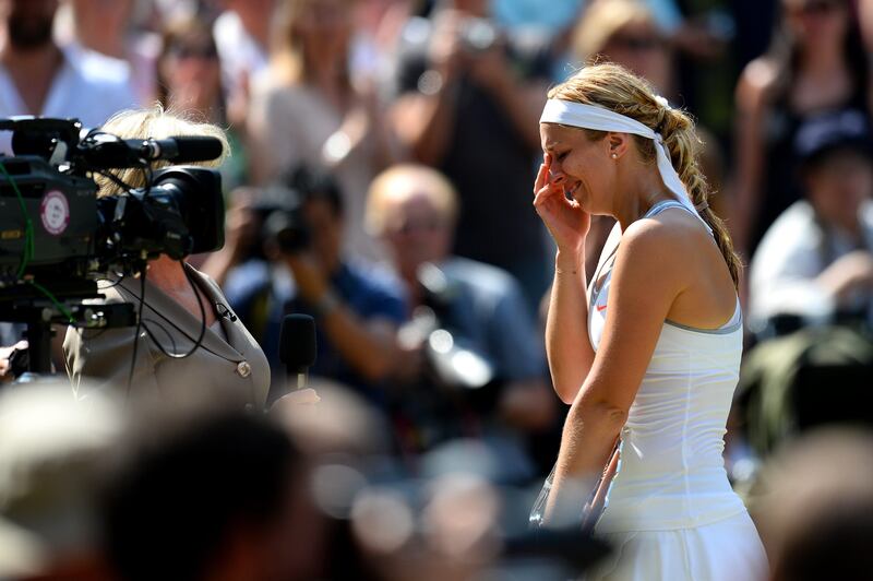 LONDON, ENGLAND - JULY 06:  Sabine Lisicki of Germany cries during a post-match interview with Sue Barker on Centre Court after her Ladies' Singles final match against Marion Bartoli of France on day twelve of the Wimbledon Lawn Tennis Championships at the All England Lawn Tennis and Croquet Club on July 6, 2013 in London, England.  (Photo by Mike Hewitt/Getty Images) *** Local Caption ***  173069016.jpg