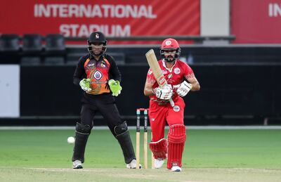 Jatinder Singh of Oman plays a shot against Papua New Guinea. Pawan Singh / The National 