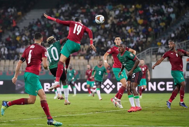 Morocco's Youssef En-Nesyri, top, scores his team's first goal. AP Photo