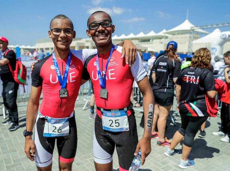 Abu Dhabi, United Arab Emirates, March 8, 2019.  Special Olympics ITU Traiathlon at the YAS Marina Circuit. -- (L-R) Micah Hambleton (UAE) and Jonah Hambleton (UAE)  after the triathlon.
Besa/The National
Section:  NA
Reporter:  Haneen Dajani