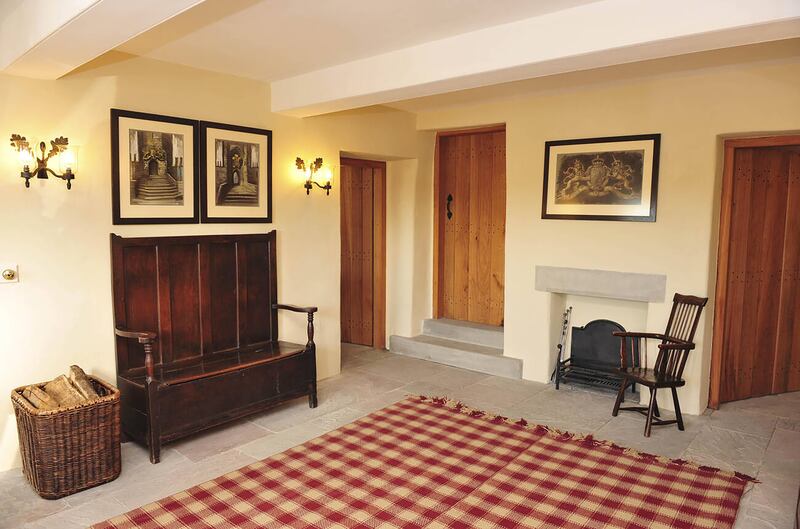 Inside Llwynywermod in Wales. The grounds comprise three cottages, a grade II-listed barn and a main house. Photo: Alamy