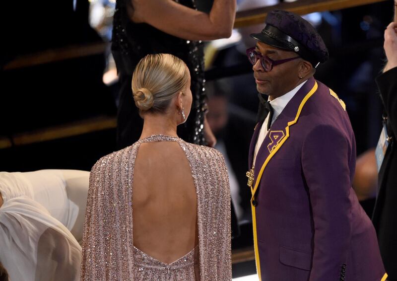 Brie Larson, left, speaks with Spike Lee in the audience at the Oscars on Sunday. AP