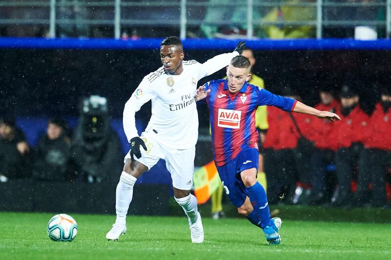 Real Madrid winger Vinicius Junior duels for the ball with Pablo De Blasis. Getty Images