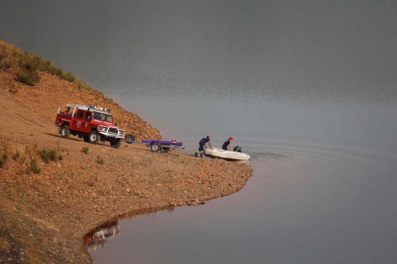 A boat heads out on to Barragem do Arade reservoir. AFP