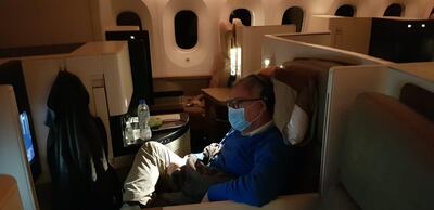 Sa-ed Jarallah watches a film on-board an Etihad flight from Geneva to Abu Dhabi on Saturday. He and his wife, Rula, were the only two passengers on-board. Courtesy: Rula Jarallah