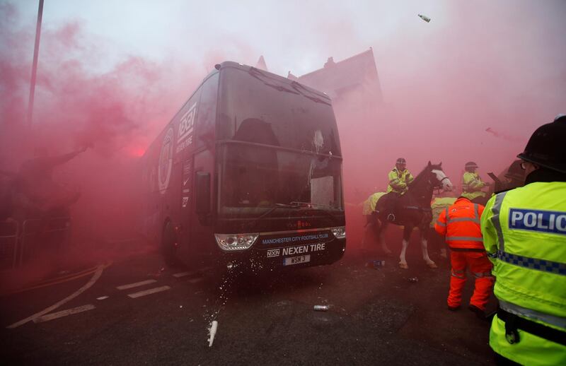 Soccer Football - Champions League Quarter Final First Leg - Liverpool vs Manchester City - Anfield, Liverpool, Britain - April 4, 2018   Liverpool fans set off flares and throw missiles at the Manchester City team bus outside the stadium before the match    Action Images via Reuters/Carl Recine