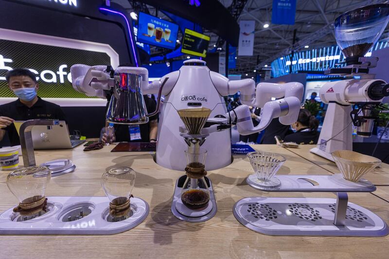 A robot barista makes coffee at the Big Data Expo in Guiyang, Guizhou province, China. EPA