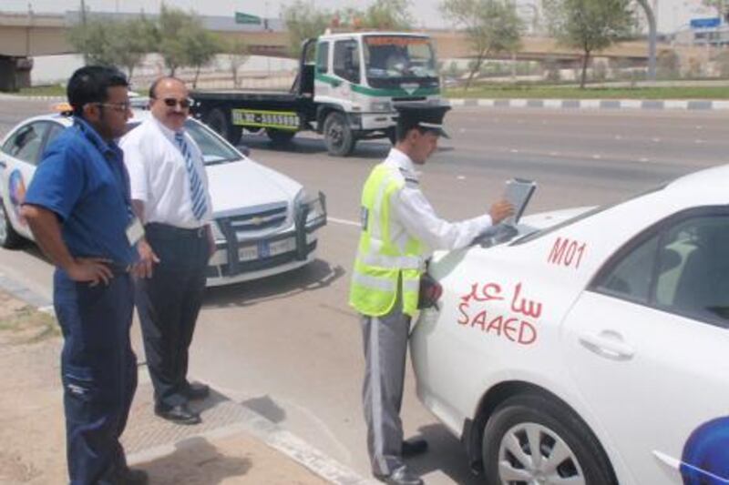 OLYMPUS DIGITAL CAMERA          Provided photo of the Saaed accident officers at accident scenes
Courtesy Abu Dhabi Police 