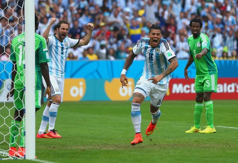 Marcos Rojo of Argentina celebrates scoring his team's third goal, the winner in a 3-2 victory over Nigeria on Wednesday at the 2014 World Cup in Porto Alegre, Brazil. Jeff Gross / Getty Images