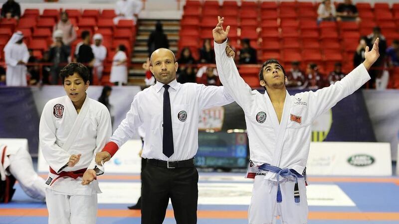 Omar Al Fadhli, pictured right, won a silver medal in the Asian Games. AFP