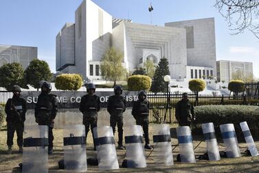 Pakistani security officials stand guard outside the Supreme Court in Islamabad, Pakistan. EPA