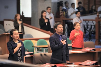 Eight-division boxing champion and Philippine Senator Manny Pacquiao attends a hearing in the Senate of the Philippines in Pasay City, Metro Manila.