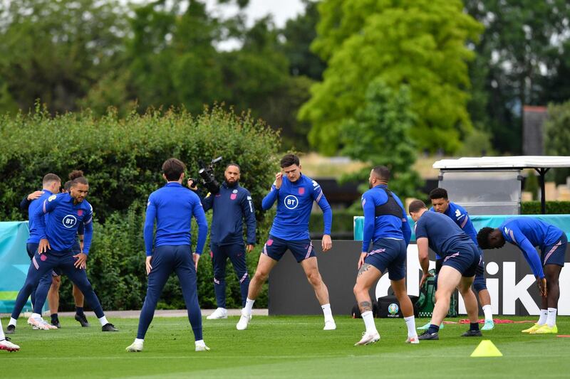 England defender Harry Maguire, centre, training with teammates. AFP