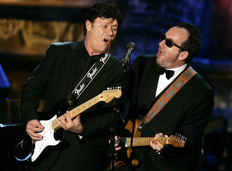 Robbie Robertson, left, with Elvis Costello in 2006. Reuters