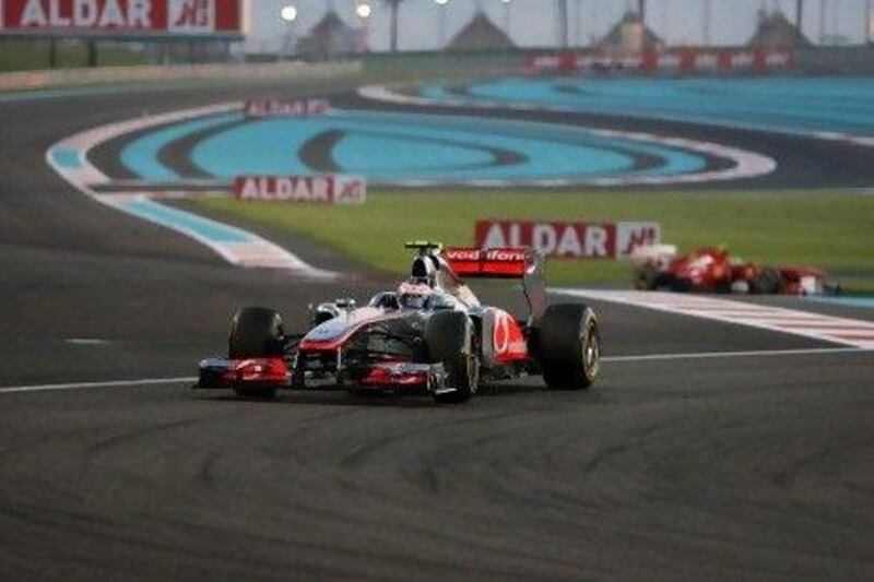Jenson Button, of the Vodafone McLaren Mercedes team, in action during the Abu Dhabi Grand Prix last November at the Yas Marina Circuit. Formula One has put its US$3 billion plan to float on the Singapore stock market on hold. Pawan Singh / The National