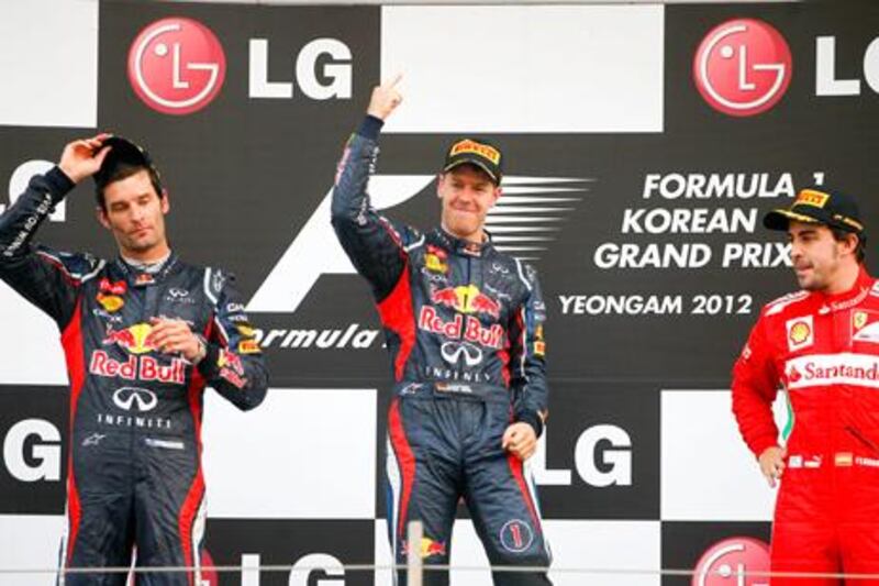 Red Bull's Sebastian Vettel celebrates his Korean Grand Prix win over Mark Webber and Fernando Alonso