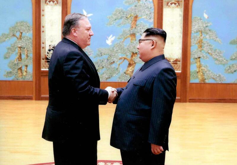 In this image released by the White House, then-CIA director Mike Pompeo shakes hands with North Korean leader Kim Jong Un in Pyongyang, North Korea, during a 2018 East weekend trip. President Donald Trump revealed more information about Pompeo's secret trip to North Korea, saying Pompeo wasn't supposed to meet with Kim, but that they ended up talking for more than an hour. Pompeo, who won Senate confirmation April 26, to become secretary of state, was the most senior U.S. official to meet a North Korean leader since 2000. (White House via AP)