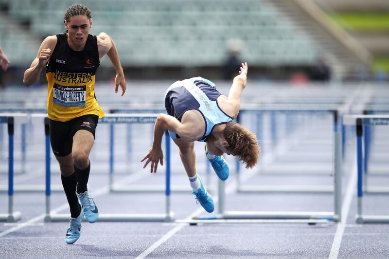Henry Murray falls after hitting the final hurdle in the 100 Metres Hurdles U16 final during the Australian Track and Field Championships in Sydney. Getty Images