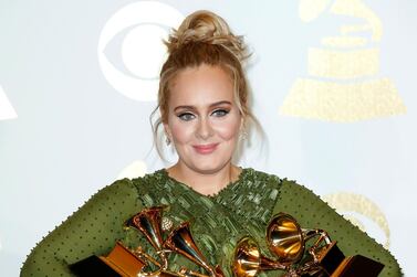 The Grammy Awards have been criticised over a lack of transparency by artists such as The Weeknd. Pictured, Adele with her five Grammys in 2017. EPA 