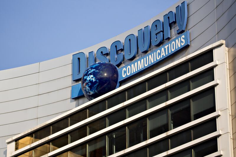 Signage is displayed on the exterior of Discovery Communications Inc. headquarters in Silver Spring, Maryland, U.S., on Thursday, July 20, 2017. Discovery, whose networks include the Discovery Channel, and Viacom Inc. are in talks to combine with Scripps Networks Interactive Inc., owner of HGTV and the Food Network, according to people with knowledge of the matter. Photographer: Andrew Harrer/Bloomberg