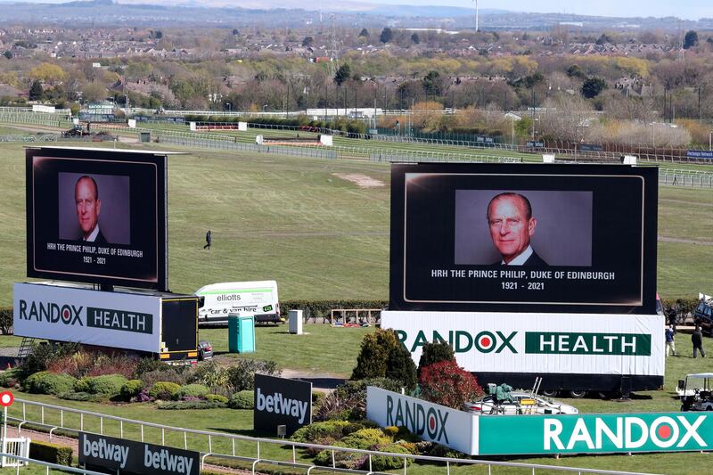 Video screens show pictures Prince Philip at the Grand National Horse Racing meeting at Aintree racecourse, near Liverpool. AP Photo