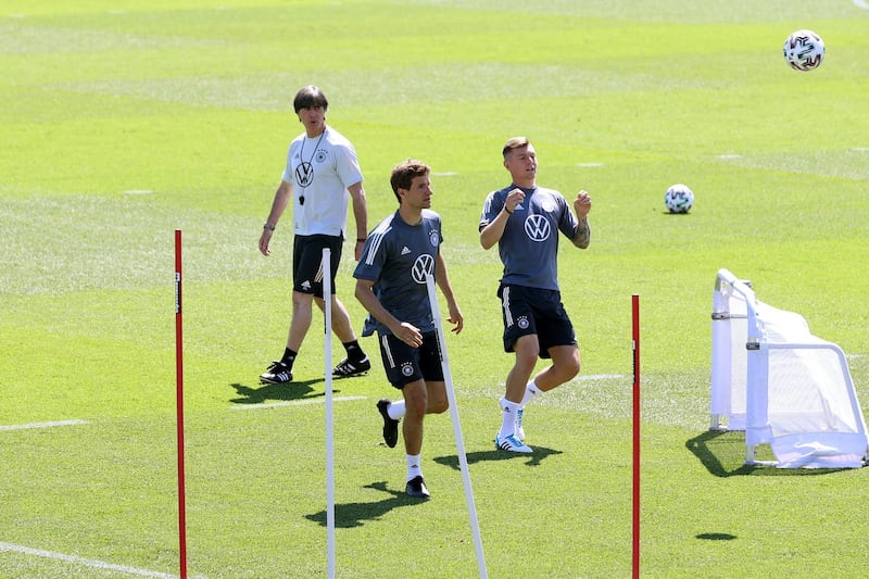 Germany manager Joachim Low watches Thomas Muller and Toni Kroos at training. Getty