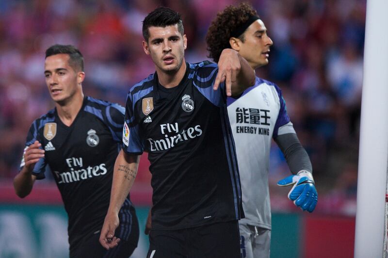 FILE - A Saturday May 6, 2017 file photo of Real Madrid's Alvaro Morata, center, celebrating scoring his goal against Granada during a Spanish La Liga soccer match between Granada and Real Madrid in Granada, Spain. Chelsea is set to strengthen its attacking options for its Premier League title defense by signing Alvaro Morata from Real Madrid. The London club said Wednesday, July 19, 2017, it has agreed terms with Madrid to sign the 24-year-old striker. (AP Photo/Daniel Tejedor, File)