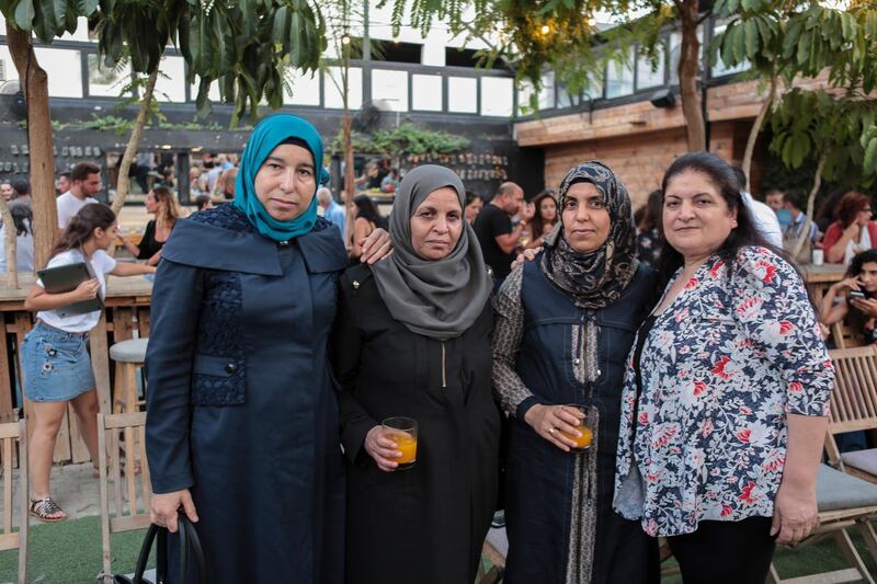 From right, Syrian refugee tailors Wafica Jarrouse and Jadia Khalaf al Kasem from Home, Mariam Al Hassan from Ghouta and Ghada Bakri Basha from Daraya helped stitch the clothes. EPA