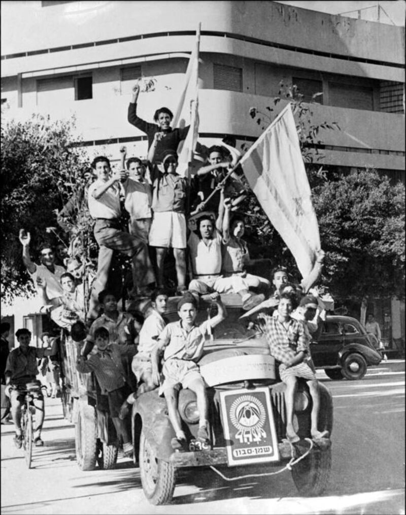 Young Jews in Tel Aviv celebrate the proclamation of the new state of Israel on May 14, 1948. AFP

