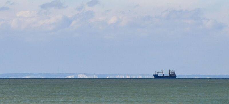  A cargo ship sails along the Channel past the White Cliffs of Dover (background) seen from the Tardinghen beach near the northern French port city of Calais on April 4, 2019. 
 Since the end of October 2018, the French and British authorities have been facing an upsurge in illegal Channel crossings from France to Britain by migrants and refugees. A plan by the French government implemented at the start of the year which stepped-up police patrols around ports, as well as surveillance of beaches where dinghies have been launched from, has seen a drop in crossing attempts according to the prefecture of Pas-de-Calais on April 4, 2019.  / AFP / DENIS CHARLET
