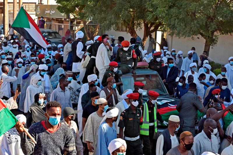 Sudanese mourners attend the funeral procession of Sudan's former prime minister and top opposition figure Sadiq al-Mahdi in Khartoum. AFP