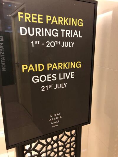 Signs at Dubai Marina Mall inform shoppers of the proposed paid parking plan. Patrick Ryan / The National