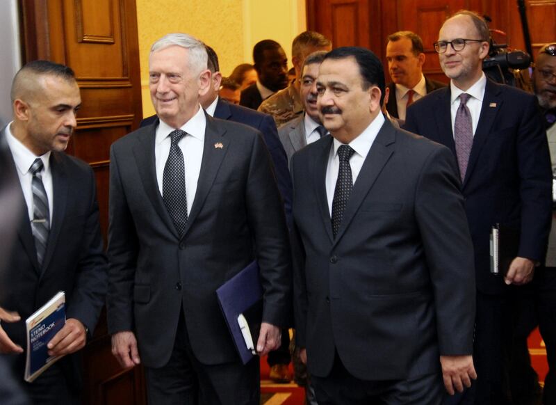 Iraq's Defence Minister Erfan al-Hiyali, walks with U.S. Defense Secretary Jim Mattis during his visit, in Baghdad, Iraq August 22, 2017. REUTERS/Stringer FOR EDITORIAL USE ONLY. NO RESALES. NO ARCHIVES.