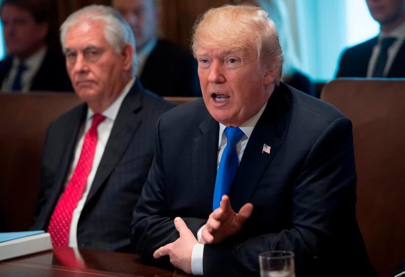 (FILES) This file photo taken on December 20, 2017 shows US President Donald Trump speaking alongside Secretary of State Rex Tillerson (L) during a Cabinet Meeting in the Cabinet Room at the White House in Washington, DC.
President Donald Trump suggested January 1, 2018 he would cut off foreign aid to Pakistan, accusing Islamabad of harboring violent extremists and lying about it."The United States has foolishly given Pakistan more than 33 billion dollars in aid over the last 15 years, and they have given us nothing but lies & deceit, thinking of our leaders as fools," Trump said in his first tweet of 2018.
 / AFP PHOTO / SAUL LOEB