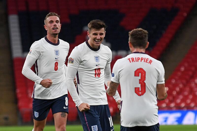 England's midfielder Jordan Henderson (L) and England's defender Kieran Trippier (R) congratulate goalscorer England's midfielder Mason Mount during the UEFA Nations League group A2 football match between England and Belgium at Wembley stadium in north London on October 11, 2020. 
  NOT FOR MARKETING OR ADVERTISING USE / RESTRICTED TO EDITORIAL USE 
 / AFP / POOL / NEIL HALL / NOT FOR MARKETING OR ADVERTISING USE / RESTRICTED TO EDITORIAL USE 
