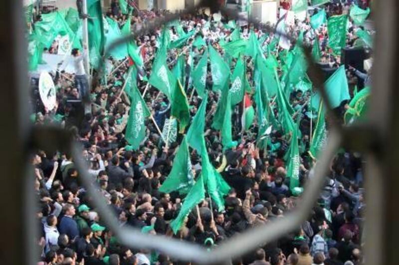 Hamas supporters take part in a rally celebrating the 25th anniversary of the founding of the Islamist movement on December 13 in the northern West Bank city of Nablus. Jaafar Ashtiyeh/AFP