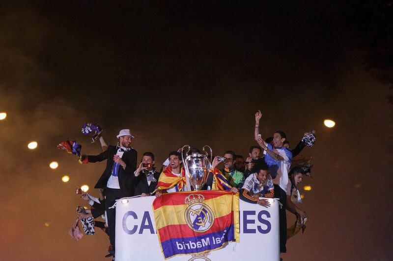 Real Madrid players Sergio Ramos, Cristiano Ronaldo, Pepe, Jesus Fernandez, Marcelo and Angel Di Maria arrive on a team bus to celebrate their victory In the Champions League final at Cibeles Square in Madrid on Saturday night. Pablo Blazquez Dominguez / Getty Images / May 24, 2014